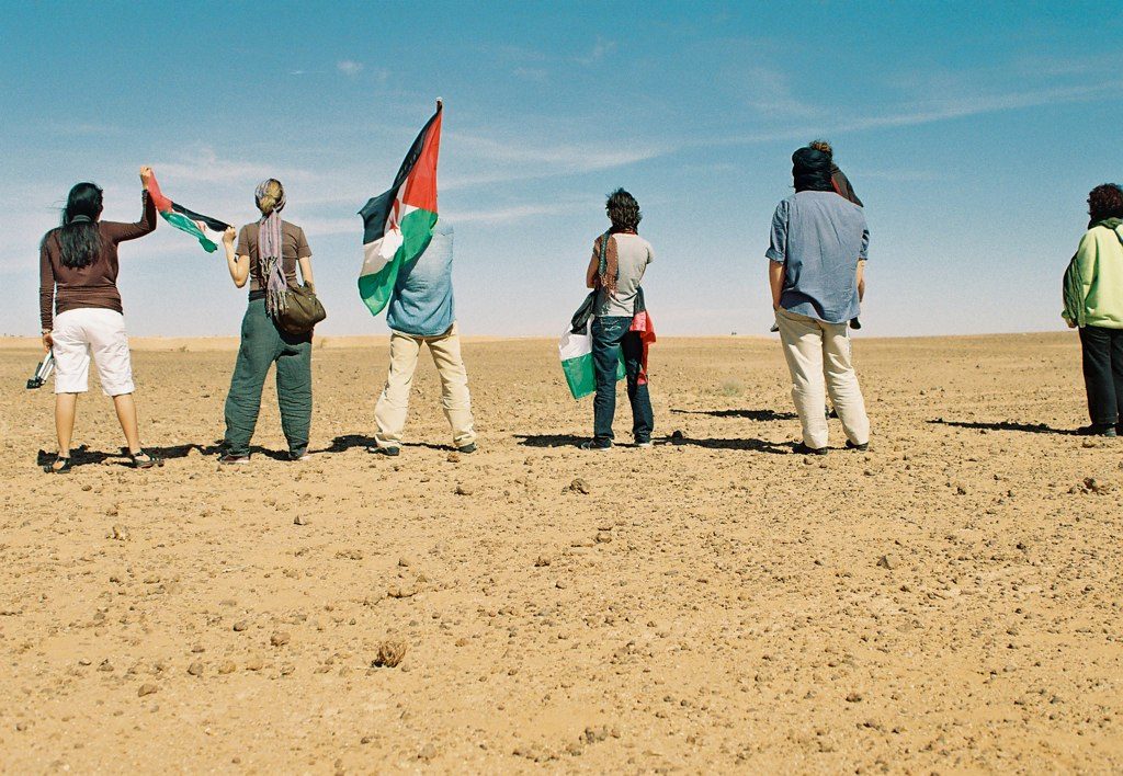 Sahrawi men facing the Berm. Credit: Michele Benericetti