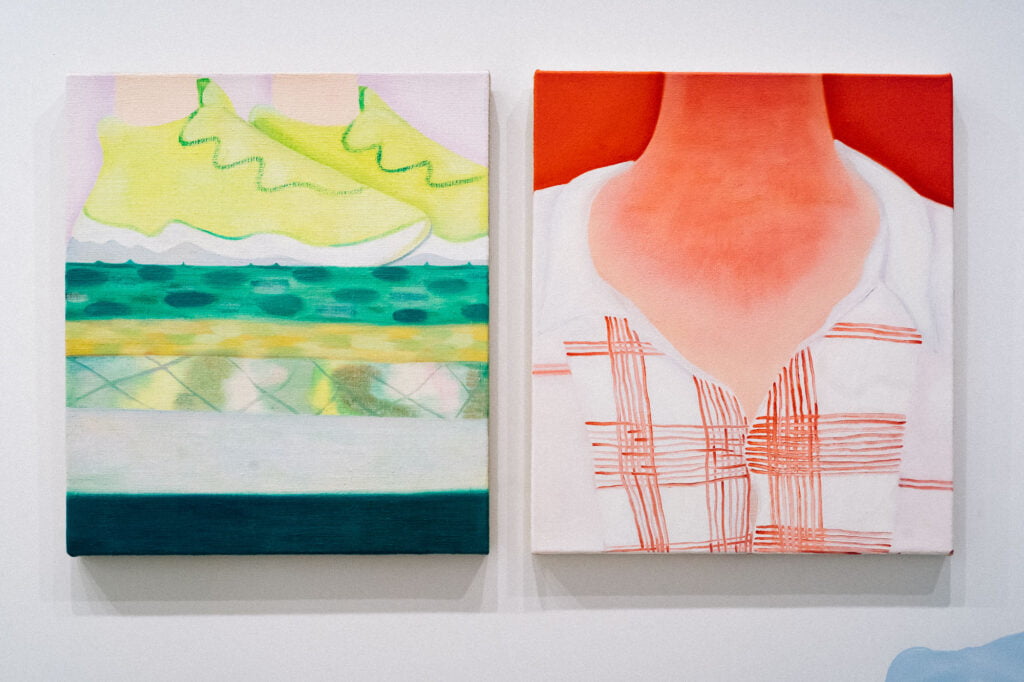 Two paintings, one of yellow trainers with green elements standing on a green and yellow surface of different patterns and the other a painting of a neck and a checked shirt, in red tones, with the light skin of the neck looking sunburnt