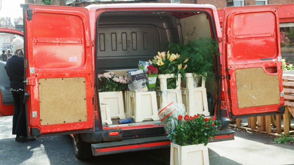 Picture of an open van with flowers inside